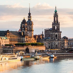 Berlin skyline with historic buildings at sunset, ideal for escort service profiles.